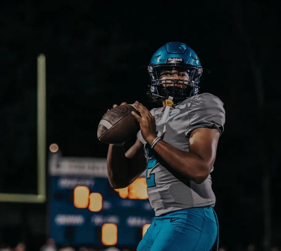Picture of a youth quarterback getting ready to throw